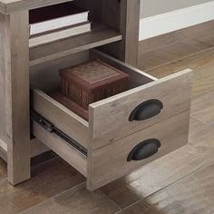 a wooden table with two drawers on one side and a book shelf on the other