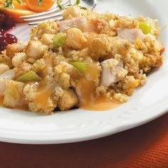 a white plate topped with stuffing and fruit