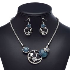 This ready-to-wear necklace featuring glass rhinestones and matching earrings is ideal for gift-giving, counter sales or extending current jewelry lines. Earnuts included. Colors, shapes and sizes may vary in each lot. Elegant Blue Alloy Jewelry Sets, Blue Alloy Earrings For Gift, Blue Metal Earrings With Rhinestones, Nickel-free Gray Metal Jewelry, Nickel-free Silver Alloy Jewelry Sets, Blue Rhinestone Round Jewelry, Silver Jewelry Sets With Rhinestones, Silver Jewelry Sets With Matching Earrings, Gray Metal Jewelry For Gifts