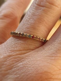 This is a 14 karat gold ring set with natural colorful saphires. The multy colors saphires are set all around. A simple yet elegant ring with colorful saphires. A dainty classic eternity band with color saphires, that will suit as a wedding, anniversary, or a gift for yourseif. -2 mm width ring -1.4 mm saphires set all around. -14 karat gold ring -Free shipping -All my jewelry are sent in a gift box Please note that you may be charged taxes by your country's customs, please check this before you Gold Half Eternity Sapphire Ring, Gold Sapphire Ring With Half Eternity Design, Gold Sapphire Ring With Half Eternity Band, Gold Gemstone Eternity Band For Promise, Gold Eternity Band With Gemstone For Promise, Promise Yellow Gold Multi-stone Sapphire Ring, Gold Sapphire Half Eternity Ring For Promise, Promise Multi-stone Sapphire Ring In Yellow Gold, Yellow Gold Multi-stone Sapphire Promise Ring