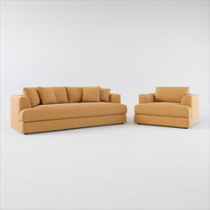 two tan couches sitting next to each other on a white surface with no one in it