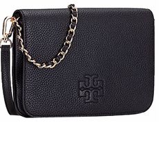 Material: Leather Color: Black With Tag Measurements: 9.5"L X 1.5"W X 6.5"H Item Name: Clutch Thealeather Cross Body Bag Type: Clutches Brand: Tory Burch. Est. Retail Price: $350.00 Tan Leather Wallet On Chain For Everyday Use, Elegant Tan Evening Wallet, Black Leather Wallet On Chain With Detachable Strap, Tan Textured Leather Shoulder Bag For Evening, Elegant Tan Leather Clutch, Black Leather Wallet On Chain With Removable Pouch, Tan Leather Wallet On Chain, Black Wallet On Chain For Evening, Formal Tan Leather Clutch