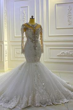 a wedding dress on display in a room