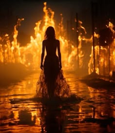 a woman standing in the middle of a fire filled street