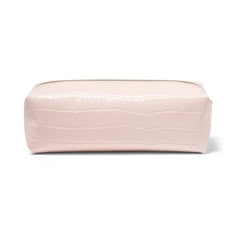 a pink makeup bag on a white background