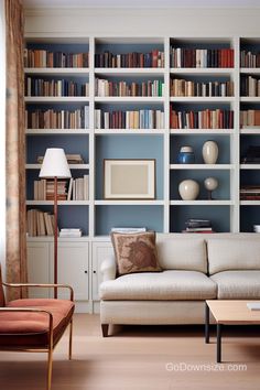 a living room filled with lots of bookshelves next to a couch and coffee table