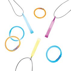 four different colored bracelets are arranged in the shape of o - rings on a white background