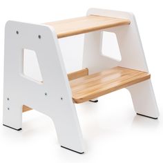 a white and wooden step stool with black legs on an isolated background for use as a child's play area