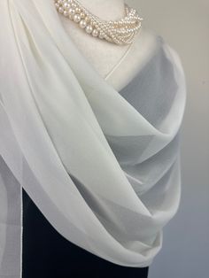 Elevate your style with our exquisite collection of chiffon shawls. Our chiffon shawls are the epitome of elegance and versatility, designed to effortlessly enhance your wardrobe and leave a lasting impression. Made from the fine poly chiffon fabric, these shawls offer a delicate and airy drape that adds a touch of grace to any outfit. Whether you're attending a special occasion, a casual gathering, or simply want to elevate your everyday look, our chiffon shawls are the perfect accessory. Choos Elegant Georgette Shawl, Luxury Silk Chiffon Elegant Scarves, Elegant Sheer Chiffon Scarves, Formal Shawl, Luxury Silk Chiffon Scarves, Elegant Style, Cream One-size Shawl Scarves, Chiffon Shawl, Sheer Chiffon, Chiffon Fabric