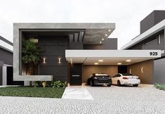 two cars parked in front of a modern house