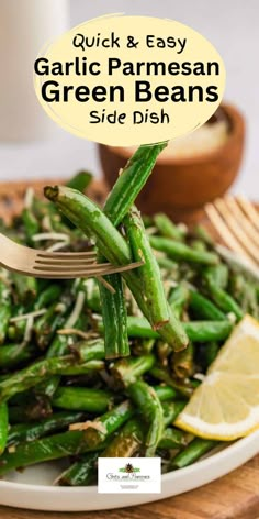 garlic and parmesan green beans side dish on a white plate with lemon wedges