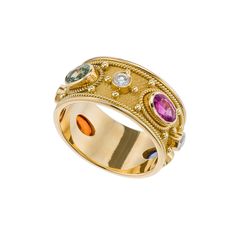 Dive into a world of color and brilliance with this exquisite gold ring adorned with an array of captivating sapphires, a statement of bold elegance and timeless allure that celebrates your vibrant personality. 100% handmade in our workshop. Metal: 14K Gold| 18K Gold Gemstones: Multi Color Sapphire oval | weight 2,27 ct Diamonds | weight 0,23 ct Discover the art of personalization as you select your dream jewelry, choosing the perfect gemstone that resonates with your unique style. Our dedicated Byzantine Ring, Byzantine Gold, Byzantine Rings, Byzantine Jewelry, Multi Gemstone Ring, Ancient Beauty, Diamonds Ring, Ancient Jewelry, 18k Gold Ring