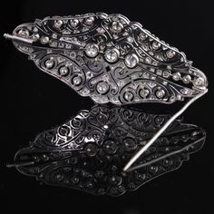 Stunning Art Deco Platinum & Diamond Brooch with beautiful delicate filigree work and milgraining. Item #JP-P0011 Metal: Platinum Weight: 17.3 Grams Diamond Weight: Approximately 4 cts of old european cut & rose cut diamonds Diamond Color: I Diamond Clarity: SI2 Measurements: 33 x 70 mm Layaway: For your convenience, we will be happy to provide layaway payment options. Please contact us to work out a layaway plan which best suits your needs. All layaway purchases are final sale. All dome Wedding Band Engraving, Rene Lalique, Diamond Brooch, Best Suits, Antique Art Deco, Diamond Fashion, One Ring, Van Cleef Arpels, Rose Cut Diamond