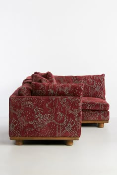 two red couches sitting next to each other