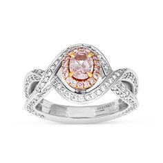 For the woman you adore, this sparkling diamond engagement ring proclaims her sophisticated style. Crafted in 99 platinum, this fashion-forward design showcases a shimmering oval cut fancy purplish-pink diamond wrapped in a rose gold pink diamond halo. The lovely diamond-lined twist shank lends a feminine appeal to the look. Set inside are beautifully equal cut pave diamonds for extra shine and dazzle. 
Available in all sizes, send us yours!
0.53 carat oval cut fancy purplish-pink diamond - Luxury Pink Oval Diamond Ring, Luxury Pink Diamond Ring With Halo Design, Elegant Pink Diamond Ring In Platinum, Elegant Pink Diamond Ring For Anniversary, Luxury Pink Halo Diamond Ring, Elegant Pink Diamond Anniversary Ring, Luxury Pink Diamond Ring With Diamond Accents, Pink Luxury Diamond Ring With Diamond Accents, Elegant Pink Diamond Ring With Diamond Accents