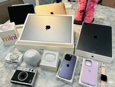 an assortment of apple products displayed on a table