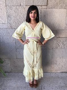 "Very rare Mexican dress, definitely a unique piece. zipper up. Made in 1970's Light Yellow pintuck cotton, you can see through it. Gorgeous details with lace. Fits size Small Measurements taken flat: Armpit to Armpit 18 1/4\" Waist 15\" HIps 19\" Bottom hem width 33 1/2\" Shoulders to bottome hem 50 1/2\"" Anarkali Dresses With Ruffles, Fitted V-neck Bohemian Kaftan, Festive Yellow Ruffled Dress, Summer Anarkali Dress With Ruffles, Bohemian V-neck Midi Dress With Lace Trim, Fitted Maxi Dress With Chikankari Embroidery, Fitted Chikankari Embroidery Maxi Dress, Spring Anarkali Dress With V-neck, Bohemian Lace Midi Dress