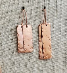 Minimal Hand Hammered Copper Rectangle Earrings--2 Sizes, Copper Dangle Earring, Steampunk, Hammered Copper Rectangle Drop Earrings Design update if you've bought these before! I now have two sizes of these fantastic hammered solid copper rectangle earrings. When my first batch of these solid copper rectangular discs arrived in my mailbox they were smaller than I had envisioned for hand stamping words; however, I soon realized they'd look great hand hammered and minimally hung from earwires. I hammered the blanks in an imperfect manner. Each pair is different, unique to you. Each of us have been hammered by life's adversities but can choose to see the beauty in how we overcome. Allow beauty to emerge from your challenges. What do you think? Two sizes now. Longer 2.25" and shorter 1.75" fro Rectangle Earrings, Earrings Design, Hammered Copper, Metal Stamping, Mailbox, Designer Earrings, A Metal, Jewelry Earrings Dangle, Sell On Etsy