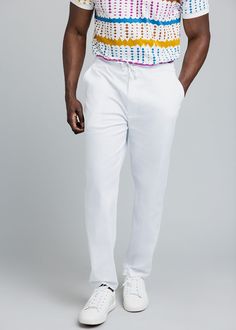 Style#M4011WHT Stretch the Summer! Our Adil drawstring pants are the perfect one-color coordinate for our multi-hued new collection. Lithe and lustrous in white stretch cotton sateen, they pair strikingly with any of our traditional tops, applique T-shirts or button-up short sleeves. The sleek cut works for just about any summer occasion, from poolside to cook-out. Features: Side and back pockets Drawstring at waist Hook and eye closure 97% Cotton/ 3% Lycra Stretch Sateen 31" inseam Designed in White Casual Pull-on Bottoms, Casual White Pull-on Bottoms, Casual White Pull-on Pants, Fitted White Chinos With Straight Hem, White Fitted Chinos With Straight Hem, Fitted Cotton Drawstring Pants, White Bottoms With Drawstring And Long Pants, White Stretch Bottoms With Drawstring, White Drawstring Long Pants