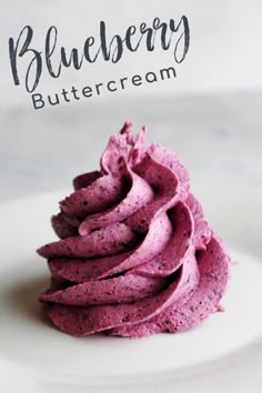 blueberry buttercream on a white plate with text overlay that reads, blueberry buttercream