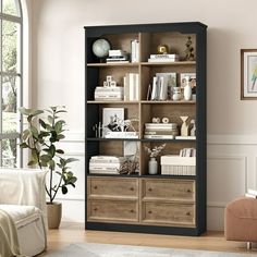 a living room filled with furniture and lots of bookshelves in front of a window