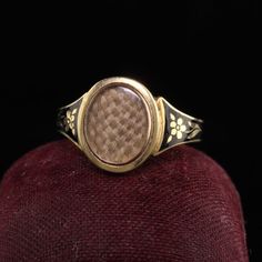 Beautiful Antique Victorian 18K Yellow Gold Enamel Hair Mourning Ring. This amazing ring has pristine enameling and the hair is still intact inside the glass. It has flower designs on the side of the ring without any damage which is rare. The inside of the ring is hallmarked.Item #R0926Metal: 18K Yellow Gold.Weight: 4 GramsRing Size: 8Measurements: Top measures 13 mm wide and band measures 2.8 mm wide.Measurement from finger to top of ring: 3.75  mmLayaway: For your convenience, we will be happy Heirloom Oval Engraved Enamel Ring, Heirloom Engraved Oval Enamel Ring, Victorian Yellow Gold Enamel Ring, Antique Engraved Yellow Gold Enamel Ring, Victorian Oval Enamel Ring For Anniversary, Heirloom Style Engraved Enamel Wedding Ring, Heirloom Engraved Enamel Ring For Wedding, Heirloom Engraved Enamel Wedding Ring, Victorian Gold Enamel Oval Ring