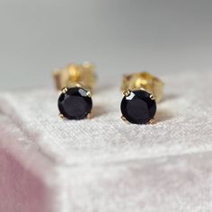 Great for everyday and casual wear. And, with their lovely sparkle and classic look, these black spinel earrings are also easy to dress up for your evenings or special occasions. Featuring top quality, genuine, untreated, spinel stones in a faceted round cut and a jet black colouring. Set into 14k gold fill ear posts, they come with matching butterfly backs. 'Gold Fill' is also known as 'rolled gold' and it is the next best quality after pure gold - it is not a plated finish and will therefore n Black Diamond Earrings For Gift, Classic Black Pierced Earrings, Classic Black Diamond Earrings For Gift, Classic Black Earrings, Gift Black Diamond Round Earrings, Gift Round Black Diamond Earrings, Black Diamond Drop Earrings Gift, Gift Black Diamond Drop Earrings, Classic Black Drop Earrings