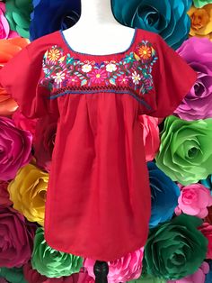 BLOUSE ONLY Materials Popelina Only Mexican Blouse Tehuacan Womans  SIZE SMALL Long 26 Inches armpit to armpit 17 inches Look in our website www.mexicotodocorazon.com This is not included Accessories belts are not included SKIRT Coco Theme Party Wash cold - dry flat to maintain brilliant colors Note: All color embroidery is slightly different, every dress is handmade, so they are different from one another, as a result you will own a unique piece. You will receive the color you selected, only em Red Peasant Top For Beach In Spring, Red Peasant Top For Spring Beach Days, Folk Style Peasant Top For Beach, Red Folk Style Blouse For Beach, Folk Style Red Blouse For The Beach, Red Folk Style Blouse For The Beach, Summer Beach Peasant Top With Floral Embroidery, Pink Bohemian Peasant Top For Beach, Floral Embroidered Peasant Top For Summer Beach