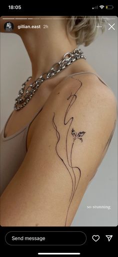 a woman with a tattoo on her arm