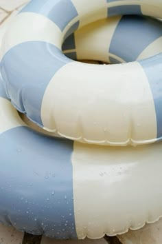 two inflatable rafts sitting on the ground