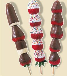 chocolate covered strawberries and marshmallows on sticks