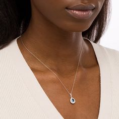 Increase the elegance factor of your dressy looks with this beautiful gemstone and diamond pendant. Fashioned in 14K white gold, this choice showcases a 6.0 x 4.0mm pear-shaped bright blue sapphire wrapped in a double frame of shimmering diamonds. Additional diamonds glisten along the linear bail to complete the design. Captivating with 3/8 ct. t.w. of diamonds and a brilliant buffed luster, this pendant suspends along an 18.0-inch rope chain that secures with a spring-ring clasp. Silver Diamond Birthstone Necklace For Formal Events, Silver Diamond Necklace With Birthstone For Formal Events, Elegant Teardrop Gemstone Diamond Necklace, Formal Silver Diamond Necklace With Birthstone, Elegant Blue Diamond Necklace For Wedding, Elegant Teardrop Pendant Birthstone Necklace For Anniversary, Elegant Sapphire Necklaces, Elegant Silver Sapphire Necklace, Elegant Sapphire Diamond Necklace For Formal Occasions