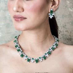 Emerald Diamond Necklace High End Jewelry adds Premium Quality green stone and shiny cubic zirconia. Perfect for wedding jewelry or any special occasions. This green emerald necklace surely add a touch of premium ness in your look. *𝐏𝐑𝐎𝐃𝐔𝐂𝐓 𝐃𝐄𝐓𝐀𝐈𝐋* * 𝐌𝐚𝐭𝐞𝐫𝐢𝐚𝐥: Brass * 𝐏𝐥𝐚𝐭𝐢𝐧𝐠: White Rhodium Plated * 𝐒𝐭𝐨𝐧𝐞: AAA-quality CZ Diamond & Green Onyx. *𝐃𝐈𝐌𝐄𝐍𝐒𝐈𝐎𝐍𝐒* *𝐍𝐞𝐜𝐤𝐥𝐚𝐜𝐞* * 𝐖𝐞𝐢𝐠𝐡𝐭: 75 gm * 𝐋𝐞𝐧𝐠𝐭𝐡: 16.5 Inches * 𝐖𝐢𝐝𝐭𝐡: 0.6 Inches *𝐄𝐚 Green Emerald Wedding, Emerald Statement Necklace, Emerald Diamond Necklace, Green Onyx Necklace, Hollywood Jewelry, Luxury Green, American Diamond Jewellery, Necklace Luxury, American Diamond Necklaces