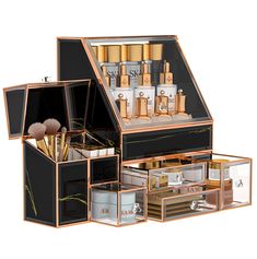 an open black and gold jewelry box filled with lots of different types of beauty products