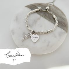 Our sterling silver memorial bracelet is at the heart of our special jewellery collection designed to commemorate cherished memories. Our beautiful range of engraved silver jewellery makes a touching memorial keepsake, presented on your choice of six elegant quote cards: With Love Thinking Of You Your Wings Were Ready But My Heart Was Not Forever In My Heart Fly With The Angels, Dance With The Stars Or a fresh white, plain quote card. This elegant sterling silver bracelet combines a silver heart Sterling Silver Bracelets With Engraved Text For Anniversary, Sterling Silver Keepsake Bracelets In Silver, Silver Engraved Bracelet For Memorial, Silver Engraved Bracelet For Memorials, Engraved Silver Bracelet For Memorial, Memorial Engraved Silver Bracelets, Sterling Silver Keepsake Bracelet, Silver Bracelets Keepsake For Mother's Day, Carton Texture