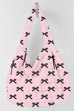 Meet your new must-have: the Black & Pink Mini Coquette Bows Wholesale Oversized Puffer Tote Bag! This tote is seriously next level, it's not just your average carry-all. Imagine a pink puffer quilted style tote adorned with adorable mini black bows, giving off all the vibes you need to slay the day. And guess what? This style isn't just trending, it's a go-to for big brands and cool girls everywhere. Why wait to get your hands on this gem? With Coquette Bow items blowing up on social media, esp Pink Weekend Bag With Removable Pouch, Pink Weekend Shoulder Bag, Pink Tote Shoulder Bag For Weekend, Trendy Pink Shoulder Bag For Weekend, Casual Pink Shoulder Bag For The Weekend, Casual Pink Shoulder Bag For Weekend, Weekend Large Capacity Pink Bag, Trendy Pink Weekend Bag, Trendy Pink Bag For Weekend