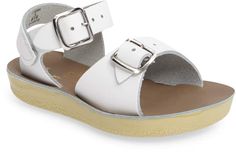 Beach Slide Sandals With Tang Buckle, Beach Sandals With Tang Buckle And Slide Shape, White Sport Sandals With Buckle For Summer, Spring Beach Sandals With Tang Buckle, Beach Sport Sandals With Heel And Ankle Strap, Vacation Jelly Sandals With Buckle Closure And Round Toe, Adjustable Buckle Closure Footbed Sandals For Vacation, Adjustable Buckle Footbed Sandals For Vacation, Casual T-strap Sandals With Adjustable Straps For Beach