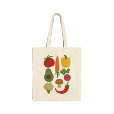 a tote bag with vegetables printed on the front and sides, including peppers, broccoli, avocado, tomato, bell pepper, cucumber, carrots