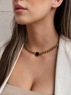 Be unique, edgy, and polished in our Nadia Chunky Chain Necklace that features a black square as the focal point amongst smooth roll of Cuban curb chain. 18K Gold Plating on Stainless Steel. Waterproof. About 15 1/2 in. + 2 in. extension Shop the matching Nadia Ring and Nadia Bracelet to complete the look. LAST CHANCE = FINAL SALE Modern Black Chain Link Jewelry, Edgy Black Chain Link Jewelry, Black Chain Link Edgy Jewelry, Black Rectangular Chain Necklace, Rectangular Chunky Chain Jewelry Gift, Edgy Gold Necklace For Gifts, Edgy Gold Necklace For Gift, Edgy Black Chain Necklace For Gifts, Black Rectangular Chain Necklace With Adjustable Chain