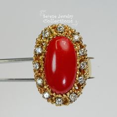 This beautiful oxtail red Coral Ring is set in 14k solid gold and a fancy diamond granulated setting! Ring Size: 7.25 Total Weight: 17.17 grams Precious Metal: 14k solid gold Precious stones: -Coral Center Stone: 20mm x 11mm -White Round diamonds: 0.4 ct Red Cluster Ring Stamped 14k, Red 14k Stamped Cluster Ring, Formal Red Cluster Ring With Diamond Accents, Heirloom Red Jewelry With Cabochon, Heirloom Red Cabochon Jewelry, Exquisite 14k Gold Red Rings, Red 14k Gold Cluster Ring For Formal Occasions, Antique Red Diamond Ring For Anniversary, Exquisite Red Cabochon Jewelry