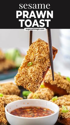 sesame prawn toast is being lifted from a bowl with dipping sauce on it