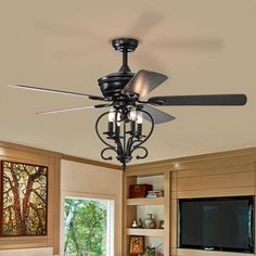 a ceiling fan with three lights in a living room