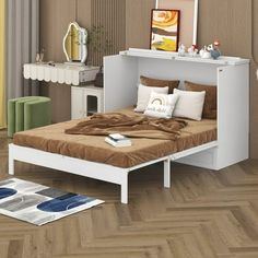 a white bed sitting on top of a wooden floor