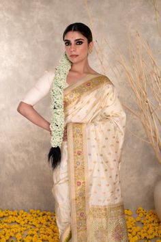 Crafted with precision and elegance, this authentic Kaduwa meenakari Pure Katan silk saree is a perfect choice for any special occasion. Its pearl white color and intricate handiwork will surely make you stand out. Experience the luxury and grace of banarasi silk with this stunning wedding saree. Elegant White Silk Traditional Wear, Transitional Silk Traditional Wear In Off White, Transitional Off White Silk Traditional Wear, Transitional Off-white Silk Traditional Wear, White Tussar Silk Saree For Puja, Bollywood Style Off White Art Silk Traditional Wear, White Silk Traditional Wear With Resham Embroidery, Elegant White Saree With Traditional Drape, Elegant White Traditional Saree