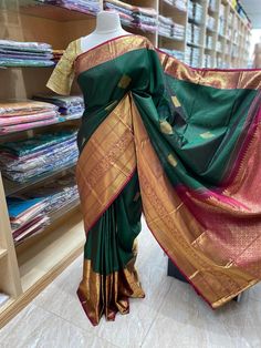 Envelope yourself in the beauty of this exquisite Kanjeevaram Silk Saree NK- 014. Crafted from the finest silk, this saree exudes luxury and sophistication. Feel the natural texture of this gorgeous piece as you make a statement at your next special occasion. Ready to Ship! Gold Saree With Zari Weaving For Rituals, Saree With Zari Weaving For Traditional Ceremonies, Diwali Saree With Zari Weaving For Rituals, Diwali Rituals Saree With Zari Weaving, Gold Tussar Silk Saree For Rituals, Elegant Banarasi Silk Saree For Rituals, Festive Saree With Pallu For Rituals, Navratri Saree With Zari Weaving For Rituals, Semi-stitched Saree For Diwali Rituals