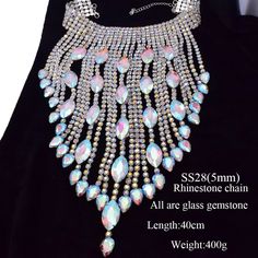 Level up your festival vibes with our Dazzling Crystal long irregular Tassel Necklace for Women. This stunning choker jewelry, bedecked with Shiny Glass Rhinestones, shimmers with a kaleidoscope of colors as you groove the night away. Crafted for both durability and flexibility, it's the ideal accessory to amp up your festival, concert, or special event style. Don't miss out on this mesmerizing festival must-have – grab yours today and dive into the festival magic! Silver Rhinestone Crystal Necklace For Festival, Festival Rhinestone Necklace, Rhinestone Alloy Choker, Party-style Long Rhinestone Necklace With Adjustable Chain, Silver Crystal Rhinestone Fringe Necklace, Festival Concert, Womens Chokers, Choker Jewelry, Party Necklace