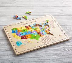 a wooden puzzle with the map of the united states