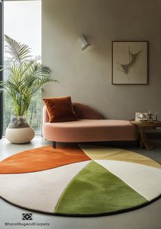 a living room with a couch, rug and potted plant