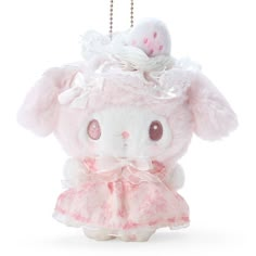 a small stuffed animal wearing a pink dress