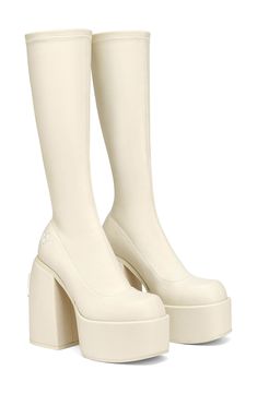 Slip into the bold '90s vibe of this sleek, stretchy tall boot with a custom platform and heel made to look both minimalist and ultramodern. Exclusive retailer 5" heel; 2" platform Synthetic upper/textile lining/synthetic sole Imported Wolfe Boots, Naked Wolfe, Dr Shoes, Tall Boot, Aesthetic Shoes, White Boots, Winter 2022, Dream Shoes, Pretty Shoes